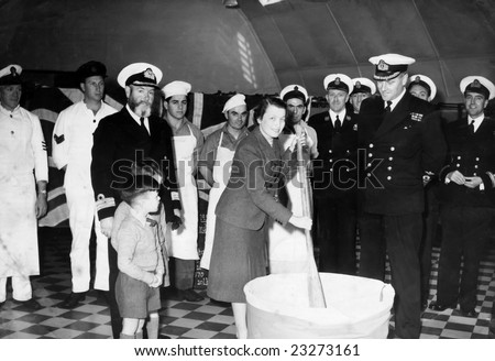 RNAS HAL FAR, MALTA - 23 DEC 1948 - Royal Navy officers prepare Christmas cake at Hal Far in Malta