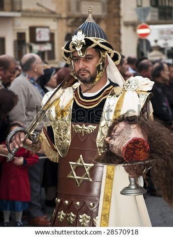 LUQA, MALTA - APR 10- Judea soldier with St John\'s head during the Good Friday procession in the village of Luqa in Malta April 10, 2009