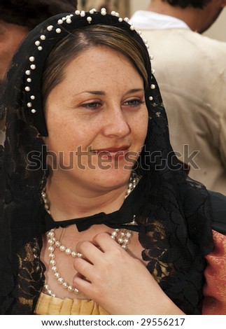 MDINA, MALTA - APR 19 : Medieval reenactment of noble woman in the old city of Mdina  April 19, 2009 in Mdina, Malta.