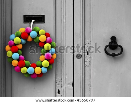 Colourful Christmas wreath hanging on an old door in the city of Mdina in Malta