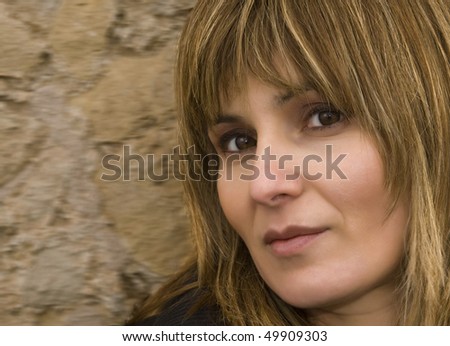 Colour portrait of a woman looking straight at the camera