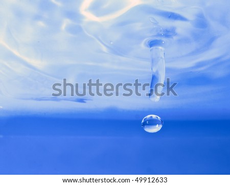 Water droplet frozen in action by off camera flash