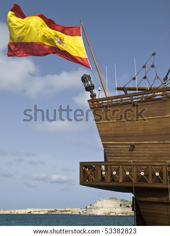 Spanish flag flying on 17th Century Spanish Armada galleon berthed at the Grand Harbour in Malta