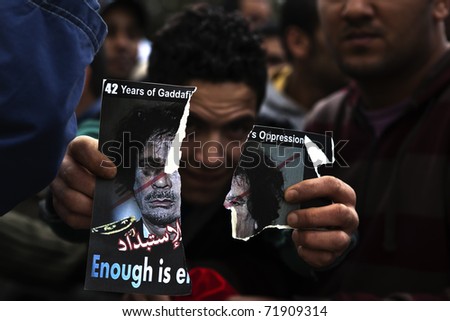 ATTARD, MALTA - FEB 22 : An unidentified Libyan anti-Gaddafi protester delivers a message during a protest in front of the Libyan Embassy on  February 22, 2011 in Attard, Malta.