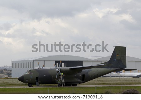 LUQA, MALTA - FEB 24 : German Air Force Hercules C-130 aircraft use Malta as hub and transit point for evacuation operations from Libya on Feb 24, 2011 in Luqa, Malta.