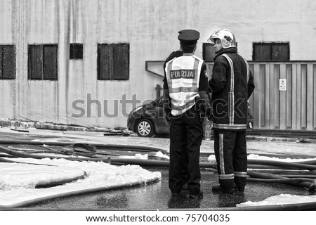MRIEHEL, MALTA - APR 12 - Police and firefighter on the scene of a fire which engulfed factory which specializes in the production of domestic and industrial detergents, on April 12, 2011 in Mriehel, Malta