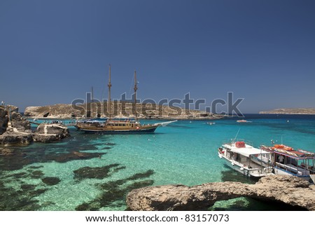 THE BLUE LAGOON, COMINO, MALTA - JUN 24 - The beautiful waters at The Blue Lagoon attract thousands of tourists aboard cruises during the summer months