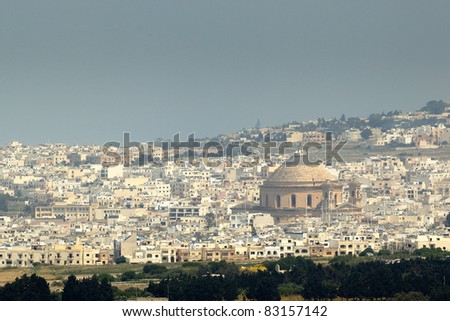The Mosta Dome is said to be the third largest in Europe, and can be seen here dominating over other modern buildings in the vicinity