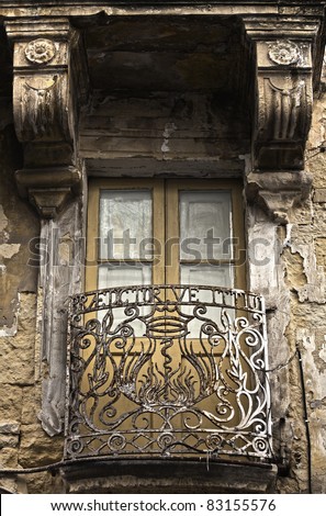 The capital city of Malta, Valletta, is a treasure trove for photographers.  Wrought iron balcony with Latin words.