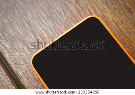 mobile, cell phone on wooden table
