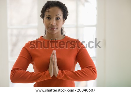Young African American woman in yoga pose
