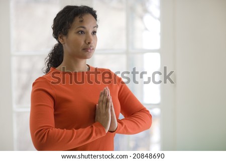 Young African American woman in yoga pose