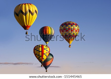 ALBUQUERQUE, NM - OCTOBER 10: A group of hot air balloons soar at Albuquerque International Hot Air Balloon Fiesta October 10, 2012 in Albuquerque, NM.