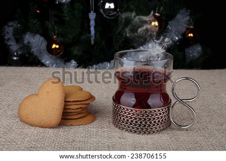 Warm mulled wine and heart shaped Christmas biscuit