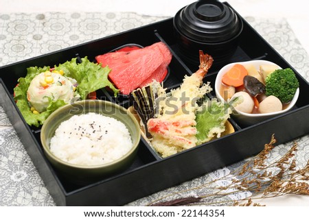 a box of fast food with japanese sushi