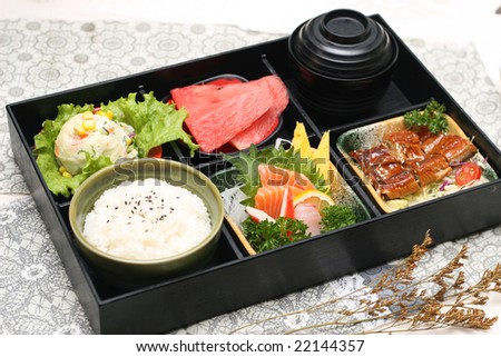 a box of fast food with japanese sushi