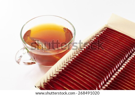 Black tea and packing on a white background