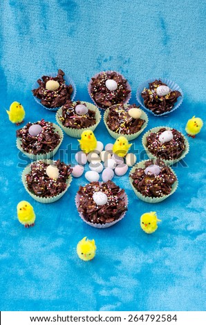 Collection of mini chocolate Easter eggs, cornflake cakes and baby chicks
