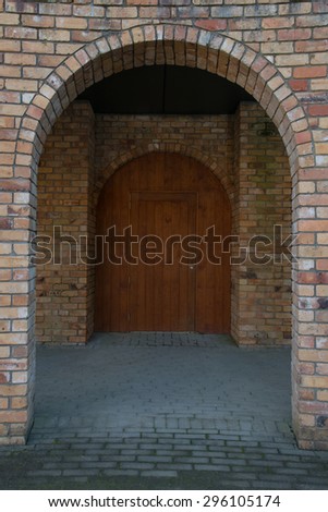 Brick archway and a wooden antique door make for a lovely photo for many applications, ideas, and concepts about anything for entering doors in our lives or closing doors.