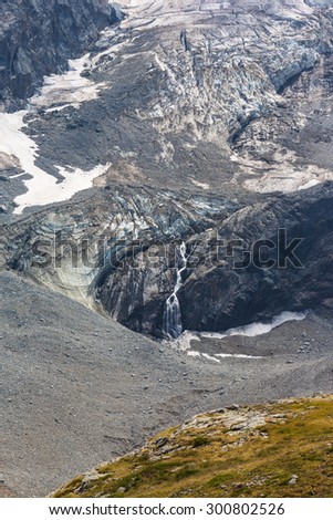 Glacier and waterfall under the peak La Meije in Ecrins national park,France