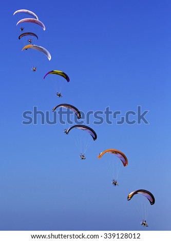 JUMEIRAH BEACH,UNITED ARAB EMIRATES-DECEMBER 2, 2013: Group of sky divers falling from the sky in Dubai,United Arab Emirates