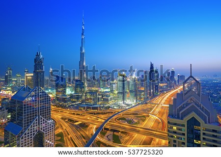 Dubai skyline at sunset with beautiful city center lights and Sheikh Zayed road traffic,Dubai,United Arab Emirates