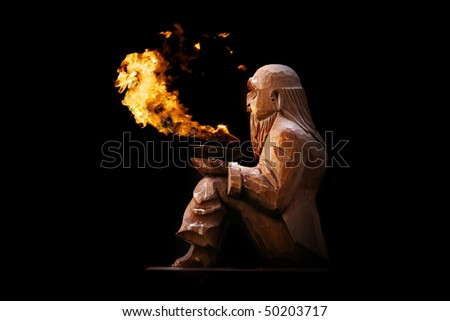 Wooden old man with fire
