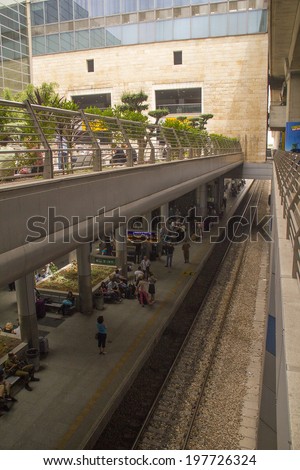 TEL AVIV, ISRAEL?? JUNE 5: Travelers wait for train from Airport on June 5, 2014 in Tel Aviv. The contemporary railway station runs north and south of Israel. It opened in 2004.