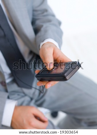 Close up of middle aged business man using cell phone