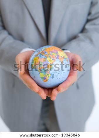 Close up of middle aged business man holding globe model