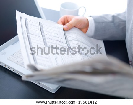 Close up of middle aged business man is working at the desk