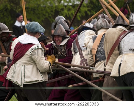 Actors wearing Stuart era,17thcentury,(reign of king Charles 1st) costumes. they are reenacting the siege of Bolsover Castle, in Derbyshire, UK, an event during the English Civil War.taken  05/05/2014