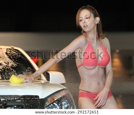 BANGKOK,THAILAND - JUNE 27 : Japanese AV actress Misaki Rola show sexy car wash during 2015 Bangkok International Auto Salon at Impact Challenger Hall MuangThong on June 27, 2015 in Bangkok, Thailand