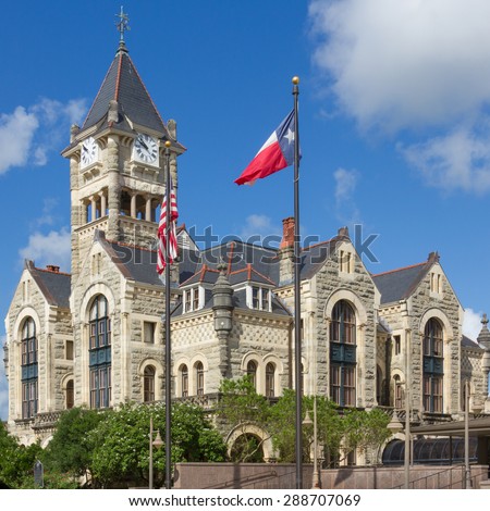 Victoria County Courthouse with Texas flag