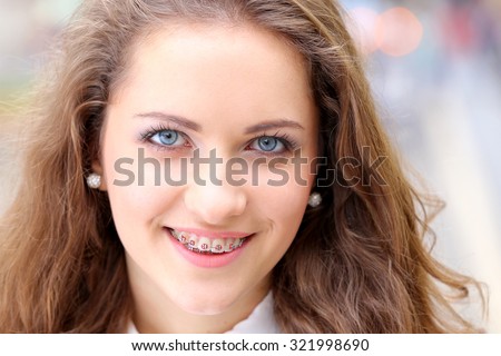 Close Up of natural beauty smiling teen face with braces