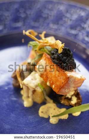 salmon dish on blue plate