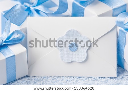 Gift boxes on a blue background with a letter-note