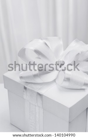 White box with a gift in a stylized white