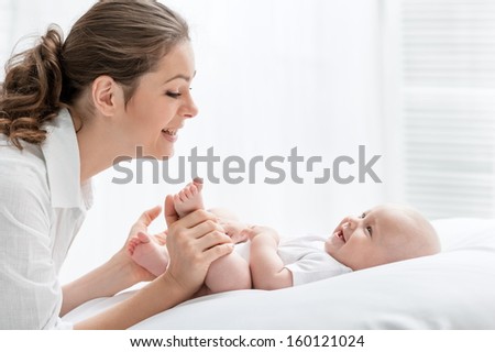 Portrait of happy mother and baby