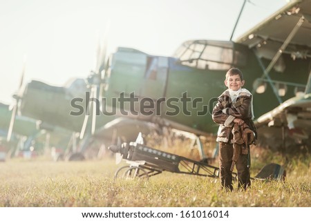 Portrait of a young aviator parked aircraft