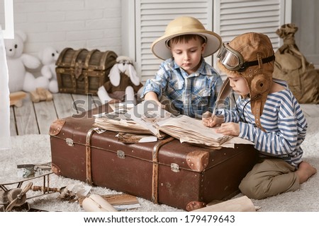 Two boys in the images of the pilot and the traveler fill your travel book