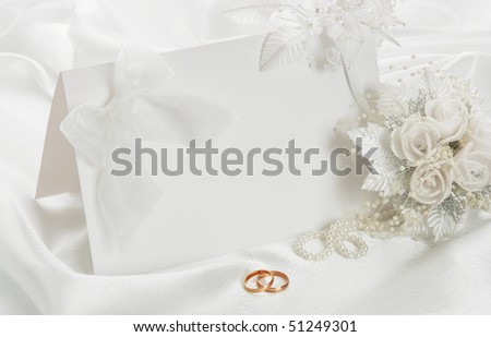 stock photo The wedding invitation with a bow on a white background