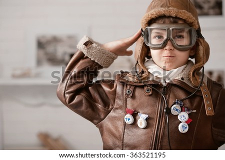 Little boy playing pilot in his room