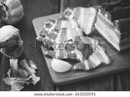 Fresh Smoked Meat With Garlic In Black And White