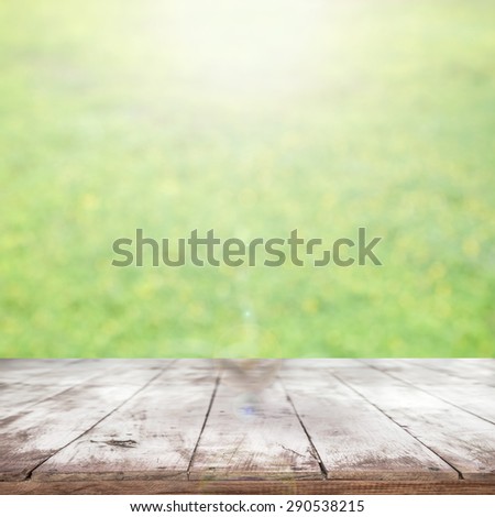 old wooden floor platform on green leaf, and flower nature background