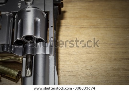close -up air gun on old wood background