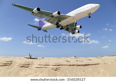 Passenger airplane landing , blue sky and sea background