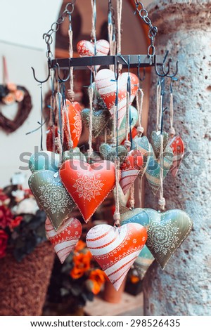 Souvenirs shaped as hearts painted with different colors exposed in Austria in the old city of Salzburg