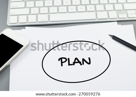 Plan buble on paper with pencil and smart phone on Computer desk