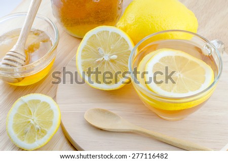 Honey lemon tea on wooden table